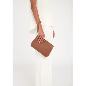 Cuyana work clutch in caramel leather